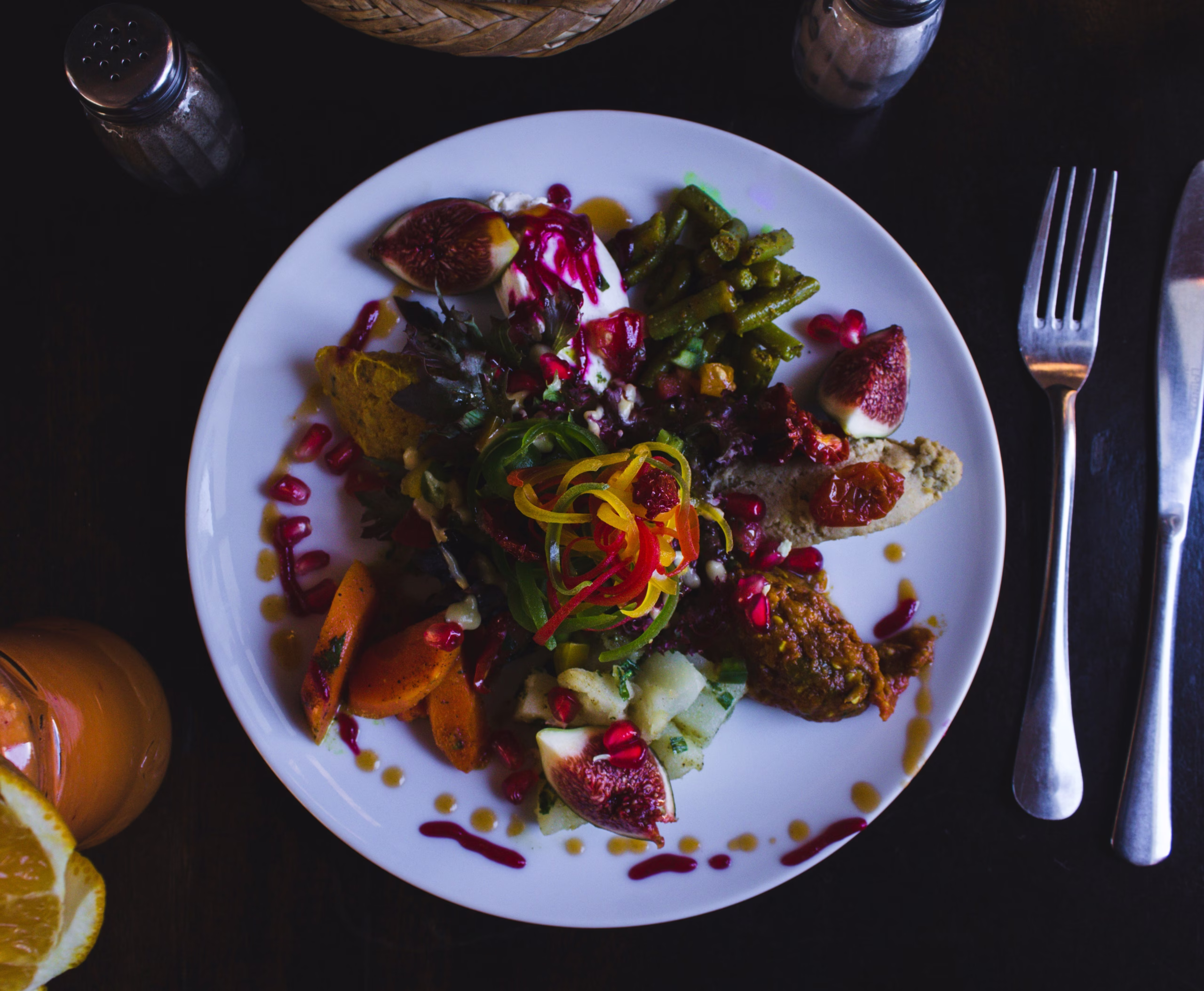 A beautifully arranged table of Middle Eastern dishes including hummus, falafel, and flatbread, representing authentic cuisine in London's best restaurants.