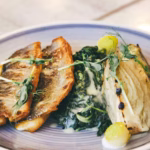 A platter of fresh Greek seafood, showcasing octopus, seabream, and prawns, symbolising the vibrant Greek seafood taverns in London.