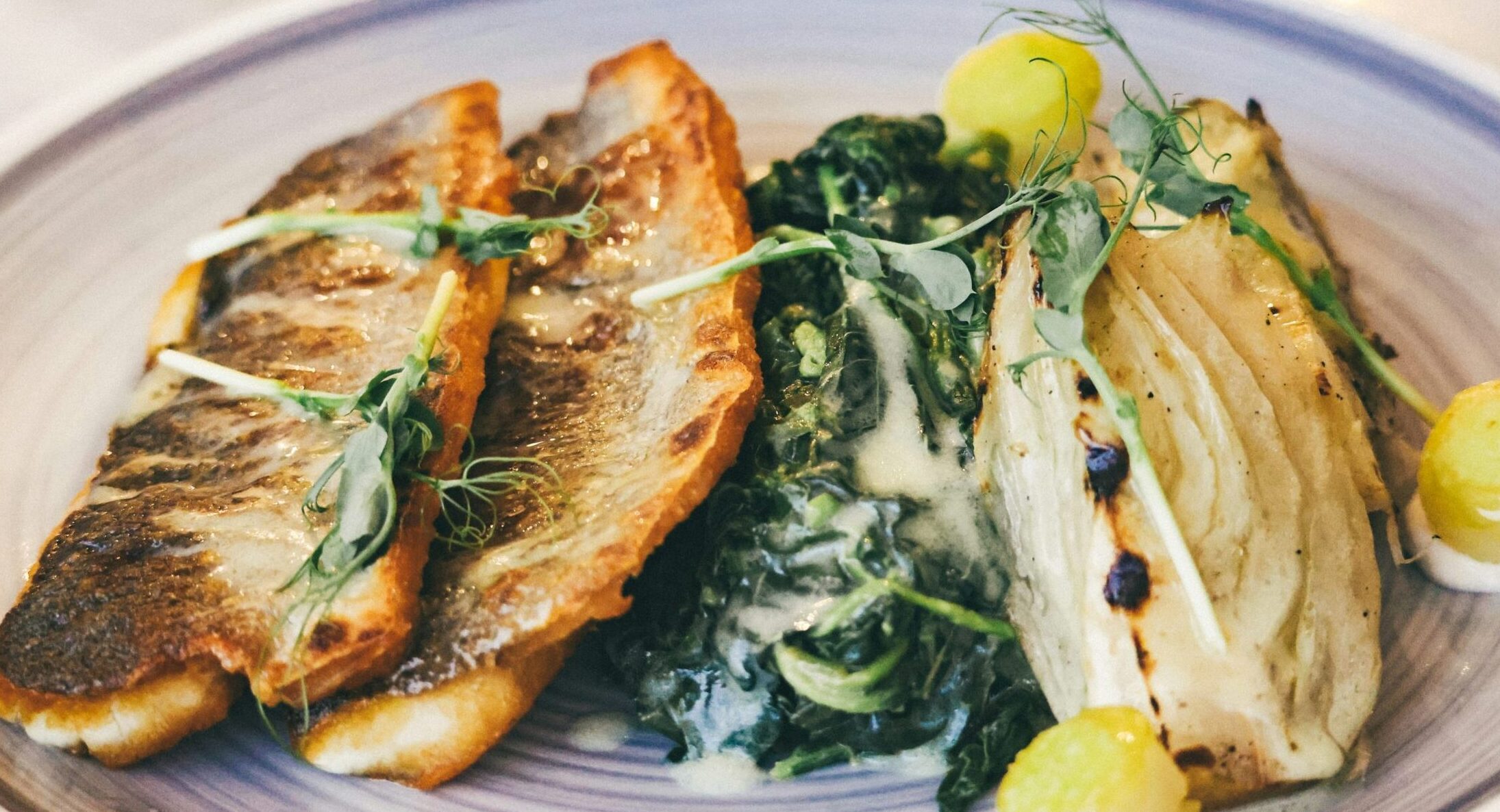 A platter of fresh Greek seafood, showcasing octopus, seabream, and prawns, symbolising the vibrant Greek seafood taverns in London.