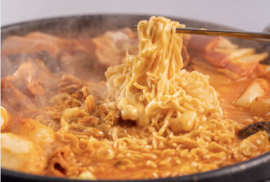 Adding gochujang beans and ramen noodles to Army Stew Korean for a hearty Korean stew.