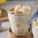Smoothie bowl topped with banana slices, granola, and a hint of ginger, representing a Korean-American fusion breakfast.