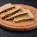 Quesadilla filled with kimchi and tuna, a spicy and cheesy Korean-American fusion breakfast.