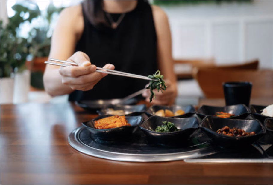 Quick cucumber kimchi recipe served with Korean rice, fried egg, and grilled meat