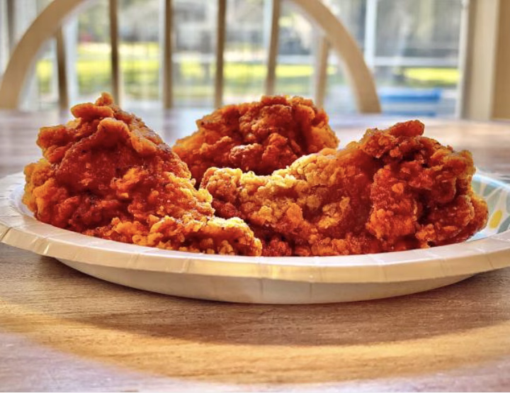 Spicy Nashville hot style buldak chicken served with sides